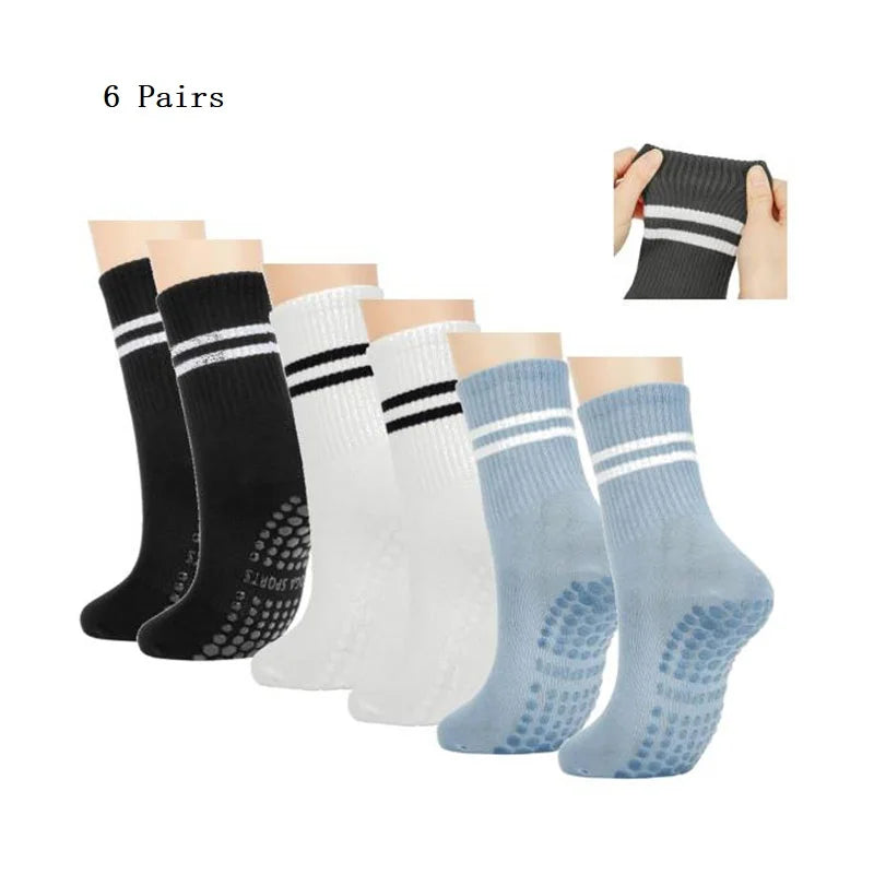 Six pairs of black, white, and light blue grip socks for Pilates, yoga, and barre