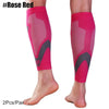 Pair of bright pink compression sleeves for the calf, shown on a foot.