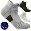 A set of three pairs of gray and black breathable ankle boat socks shown in various angles.