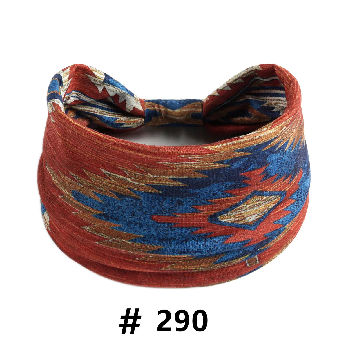 A close-up of a reddish-orange boho cotton turban headband with blue and gold geometric patterns.