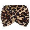 Boho leopard print fabric tied into a scrunchie or headband