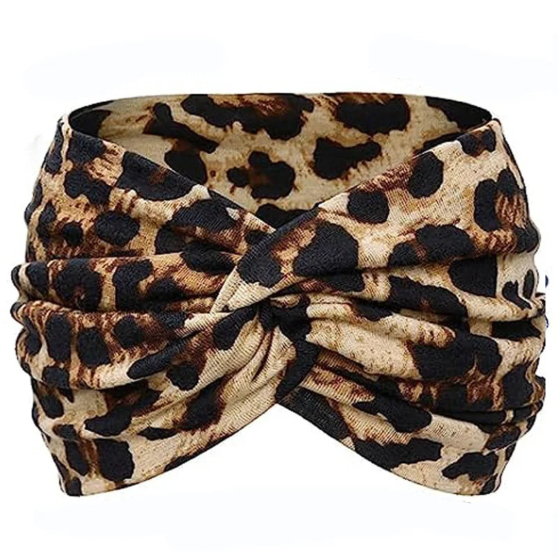 Boho leopard print fabric tied into a scrunchie or headband