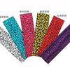 A collection of women's sports headbands featuring various animal prints including leopard, solid colors, and abstract patter
