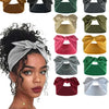 Collection de bandeaux élastiques de couleur unie dans diverses nuances : marron, noir, vert, beige, jaune, rose et gris.