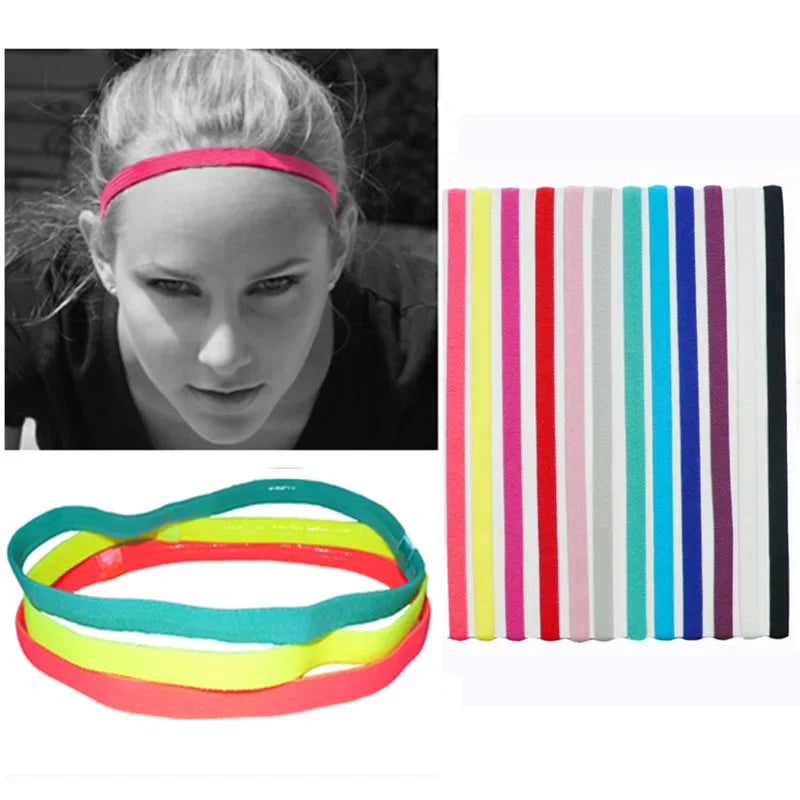 A collection of five brightly colored elastic silicone sports headbands in various stripes.
