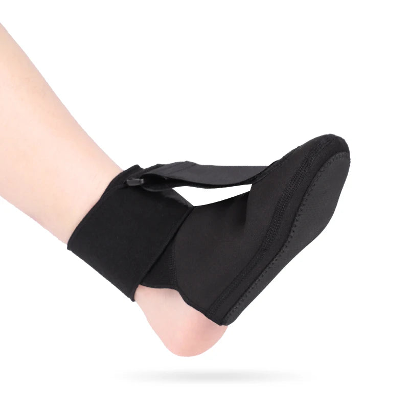 Black adjustable ankle brace worn on a person's foot and ankle.