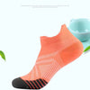 An orange performance compression sports sock is displayed against a white background.