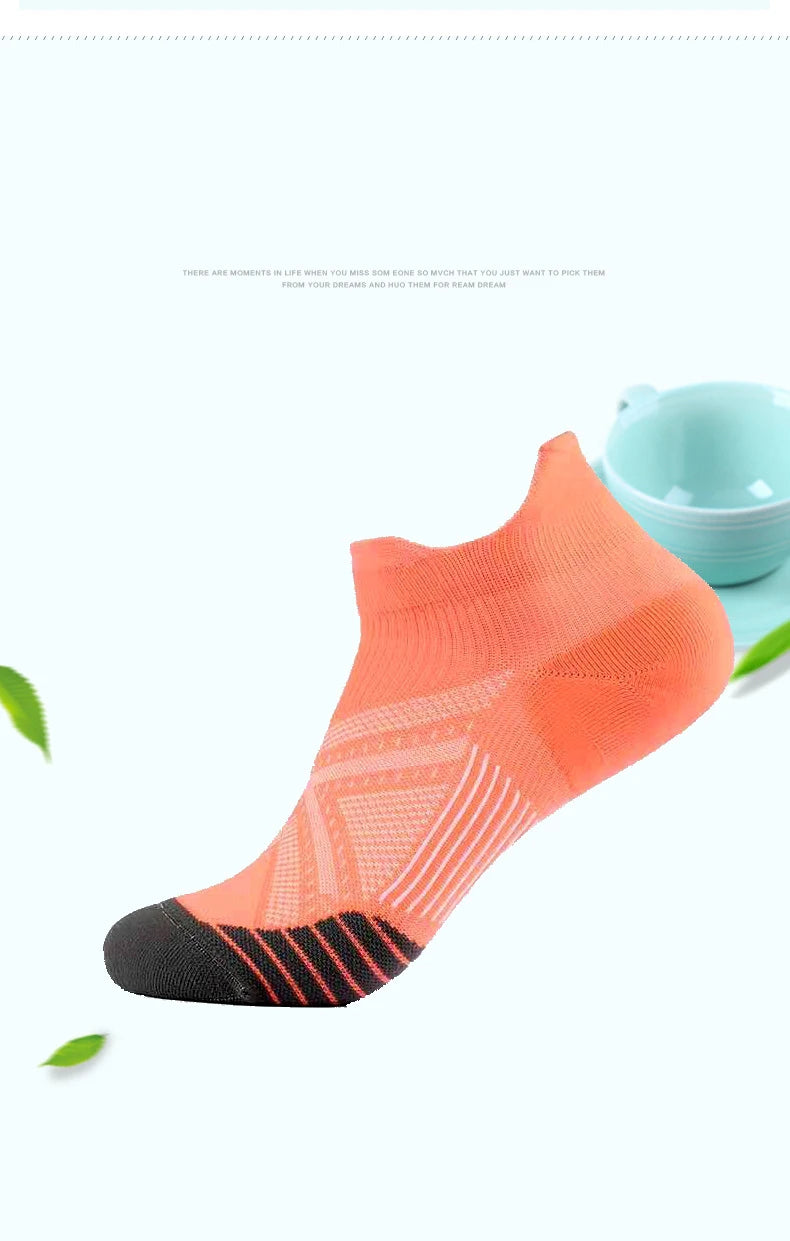 An orange performance compression sports sock is displayed against a white background.