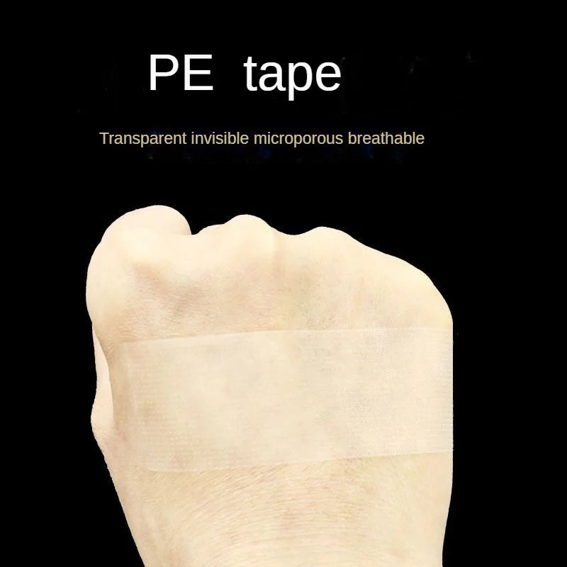 A piece of transparent medical tape is applied to the skin of a finger.