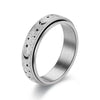 Silver stainless steel ring with a textured band featuring a design of stars and crescent moons.