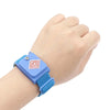A hand wearing a blue adjustable ESD wrist strap for electronics safety.
