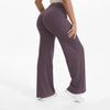 A person is modeling a pair of mauve NCLAGEN SoftMotion straight leg yoga pants.
