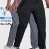 A man is wearing black jogger pants and white sneakers, demonstrating the fit of breathable casual joggers.