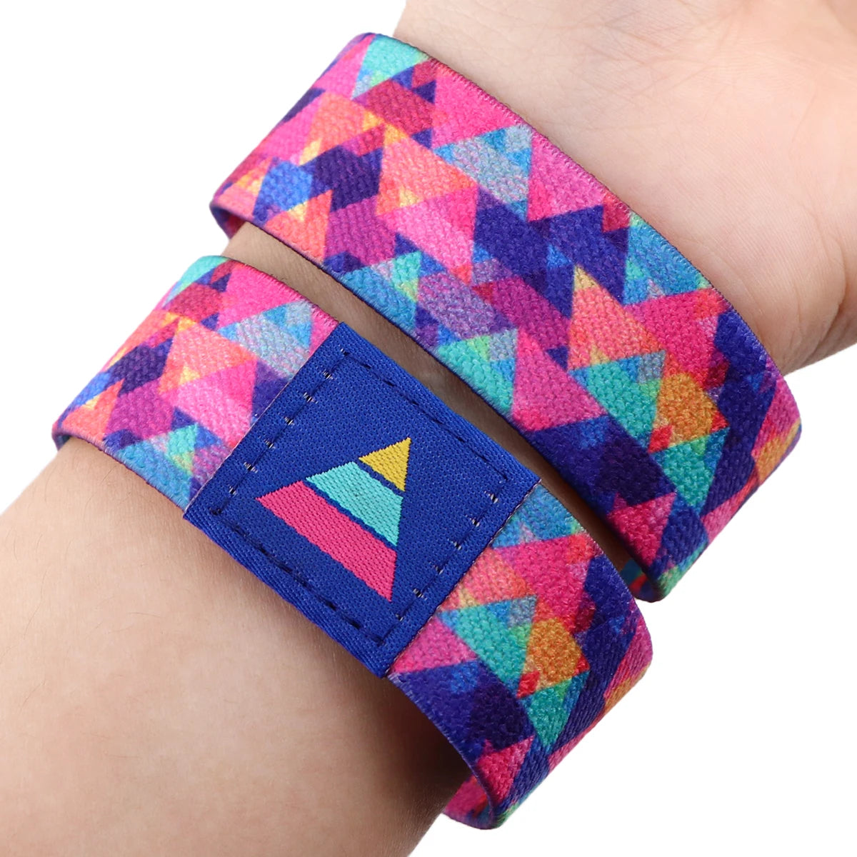 A colorful LGBT stretch wristband bracelet featuring a geometric pattern in pink, purple, and blue.