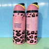 A pair of pink insulated stainless steel sports water bottles with black leopard print accents.