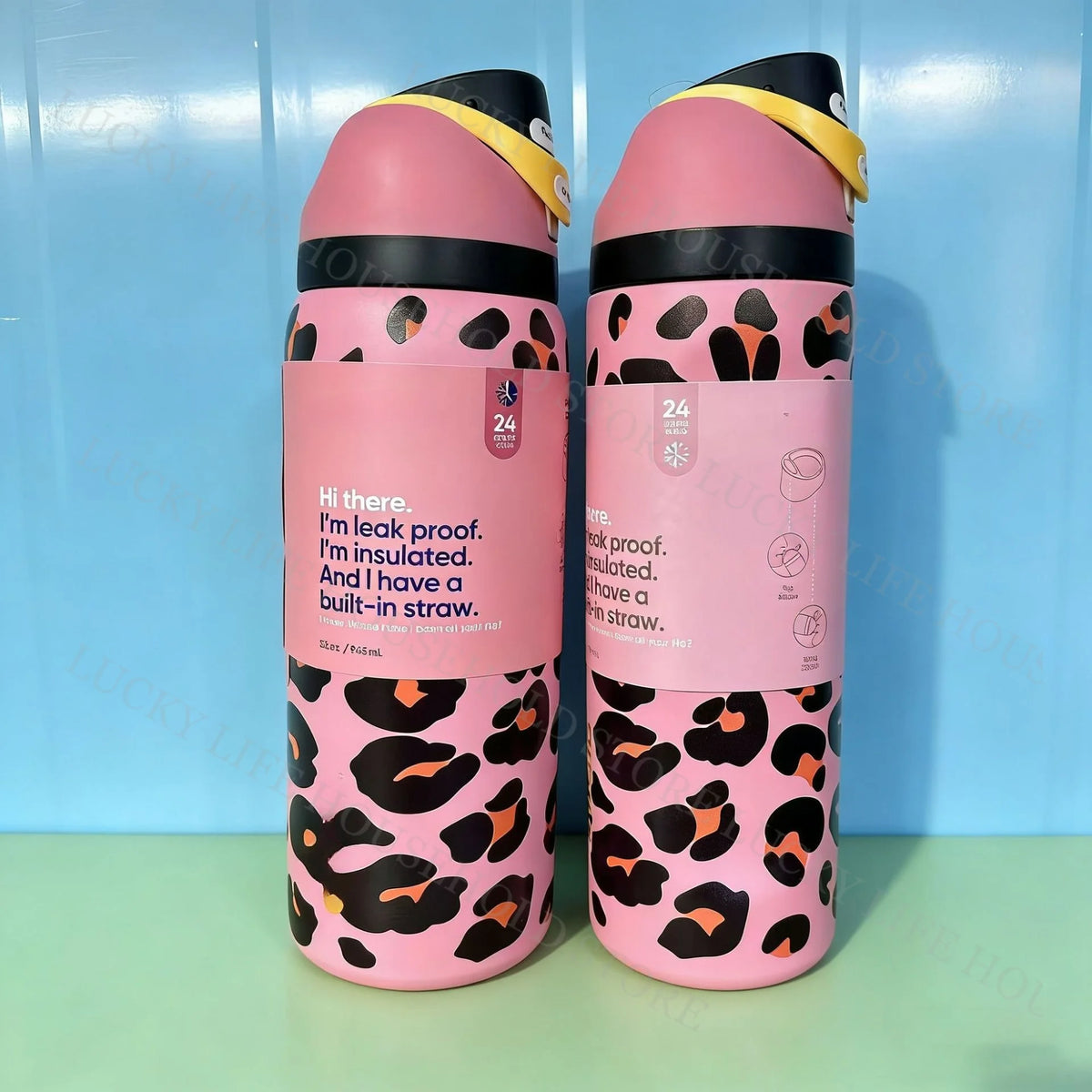 A pair of pink insulated stainless steel sports water bottles with black leopard print accents.