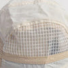 A close-up of a white breathable quick-dry baseball cap with a sheer mesh panel on the front.