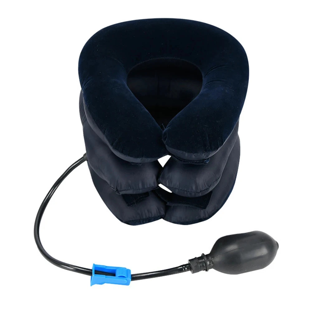 A dark blue inflatable cervical traction stretcher with a black hose and a rubber bulb.