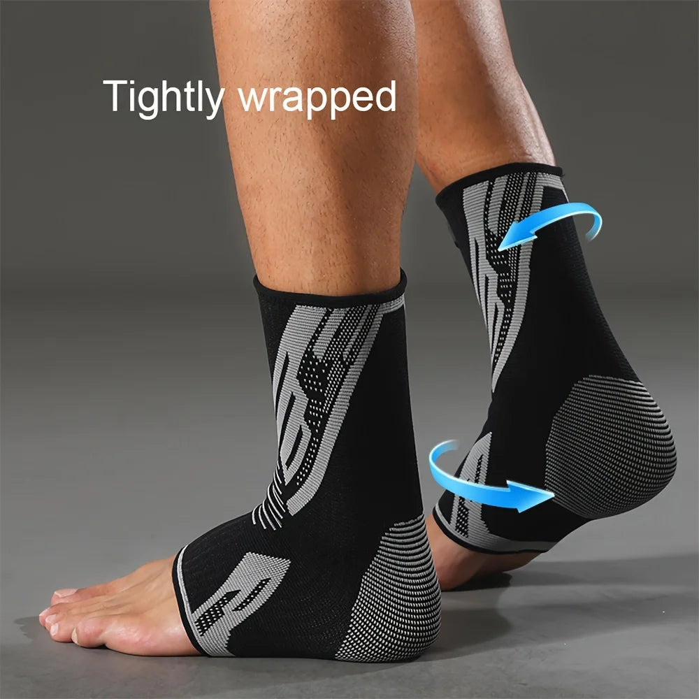 Close-up of a person's lower leg wearing black compression sleeves with a patterned design.