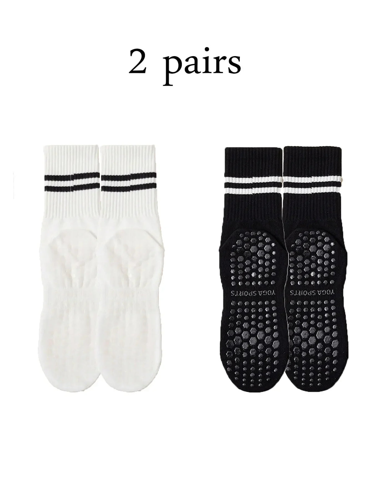 Two pairs of black grip socks with white stripes and two pairs of white socks with black stripes