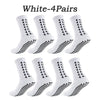 Four pairs of white multi-sport athletic grip socks displayed together.