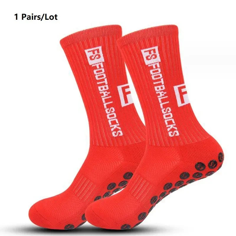 A pair of bright red anti-slip performance sports football socks displayed on a white background.