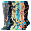 A collection of knee-high compression socks featuring various butterfly patterns in gray, blue, yellow, and orange tones.