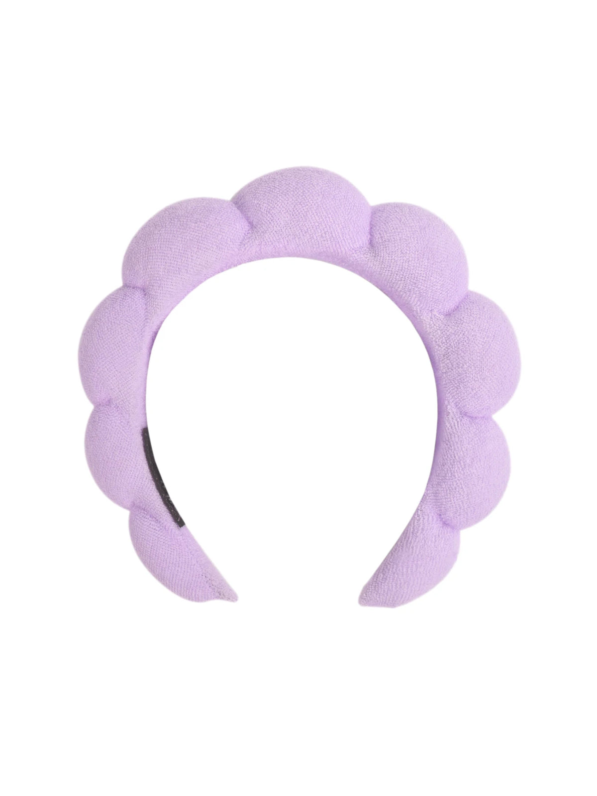 A lavender microfiber skincare headband and wristband set.