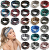 A collection of bohemian vintage print headbands in various colors and patterns displayed on a model's hair.