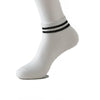 White sock with black stripes on the ankle, showing non-slip grip socks for yoga and pilates.