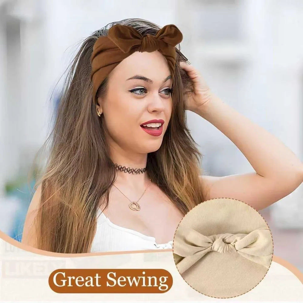 A woman models a brown bohemian bunny ear headband with long hair and a white top.