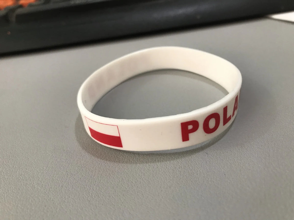 White silicone wristband with a red flag design and the word POLAND printed on it.