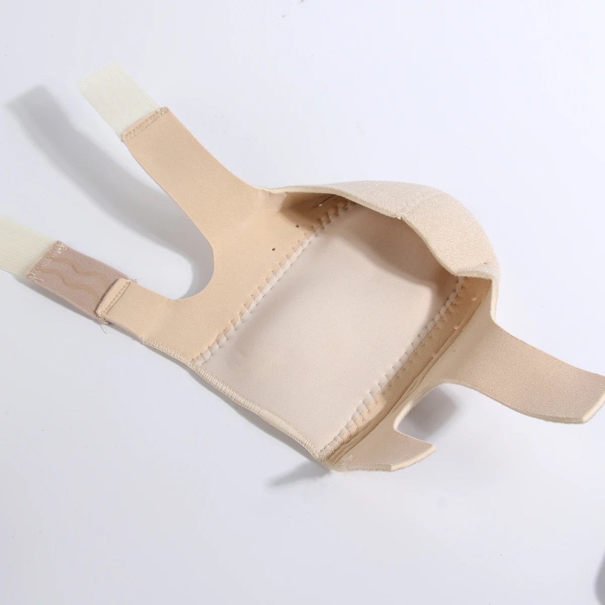 A beige adjustable gel heel cup designed for foot pain relief.