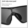 A close-up view of black sunglasses with anti slip nose pads attached.