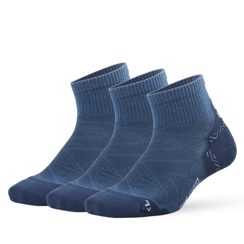 A set of dark blue breathable performance running socks laid out flat.