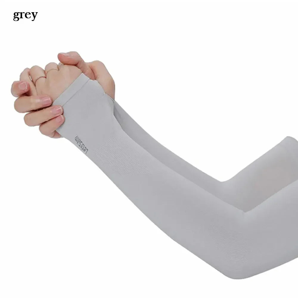 A close-up of a grey all-weather arm sleeve being worn on an arm.
