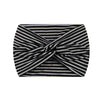 A black and white zigzag patterned wide knotted headband.