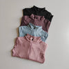 Three stacked quick-dry yoga and fitness jackets in black, mauve, and light blue.