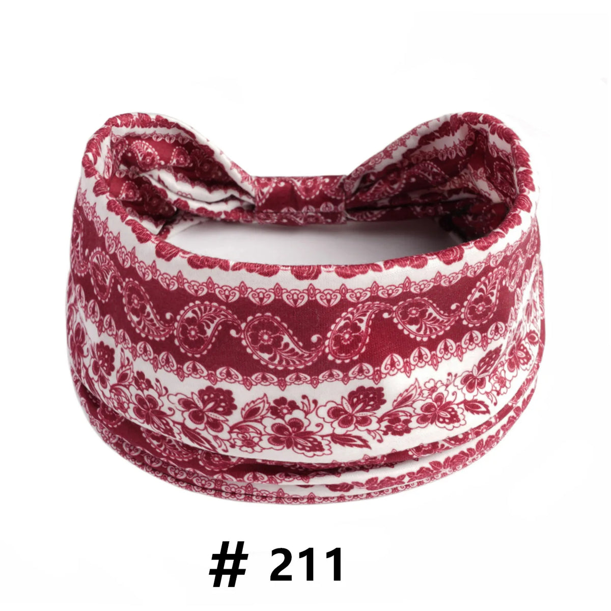A close-up of a maroon and white patterned boho cotton turban headband
