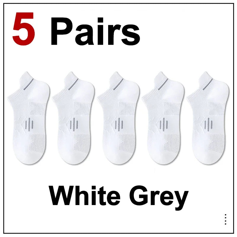 Five pairs of white grey breathable men's running socks displayed side by side.