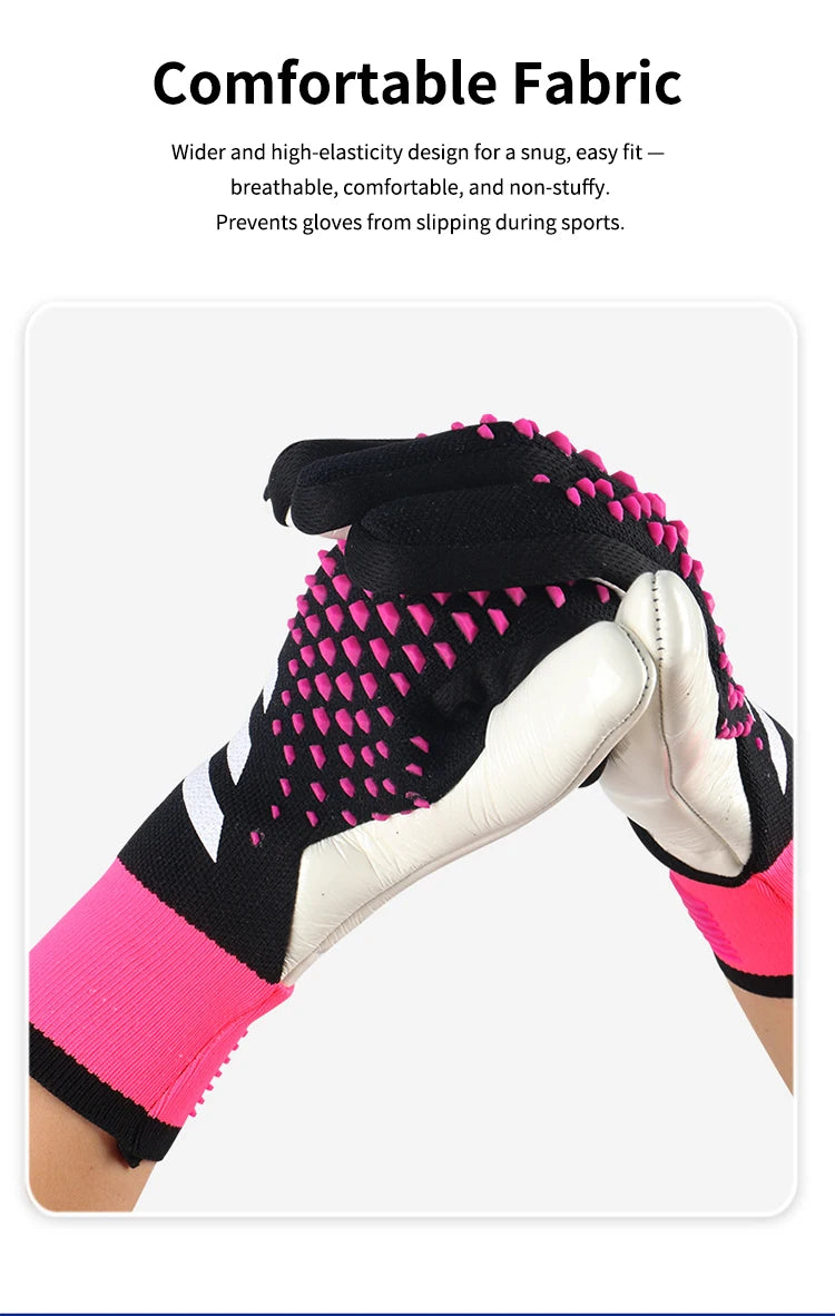 A close-up view of pink and black goalkeeper gloves with textured fabric on a hand.