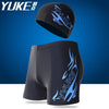 Black men's swim suit featuring a cap and ear plugs with blue flame graphics