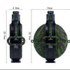 A black silicone camping kettle with a camouflage green sleeve and black handle.