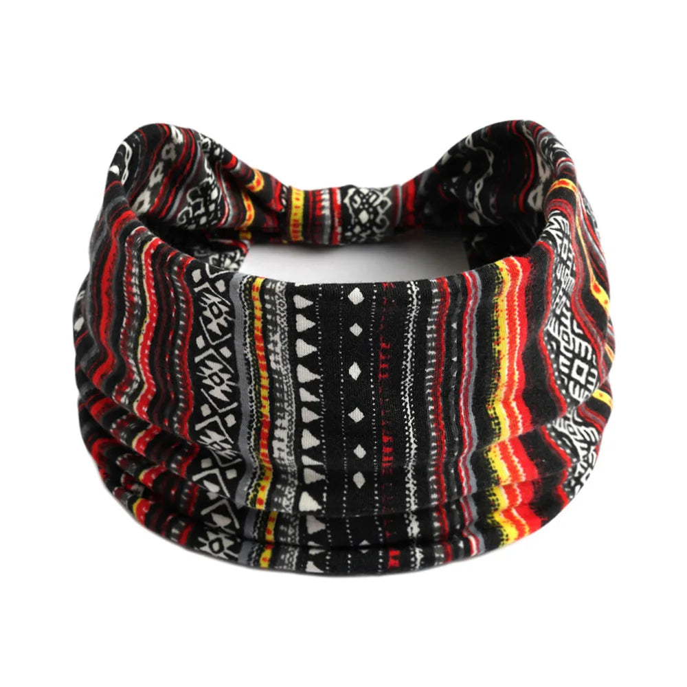 A black and multicolored bohemian cotton stretch headband with intricate patterns.
