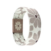 A beige stretch silicone wristband bracelet featuring a white flower pattern and a rectangular brown accent.