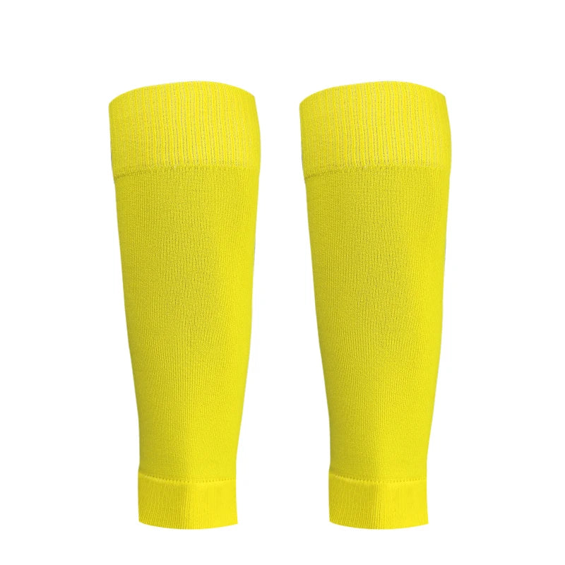 A pair of bright yellow honeycomb grip football socks shown vertically.