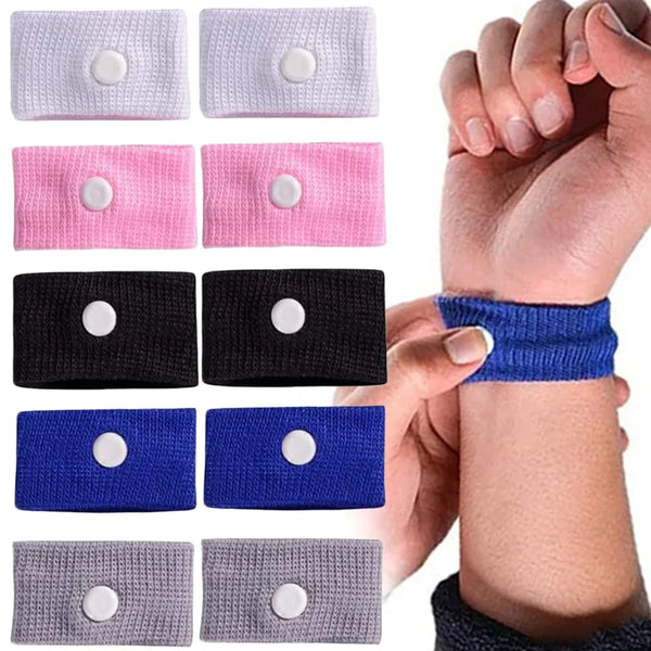A collection of various colored wristbands for anti-nausea relief, including pink, purple, black, blue, and gray.