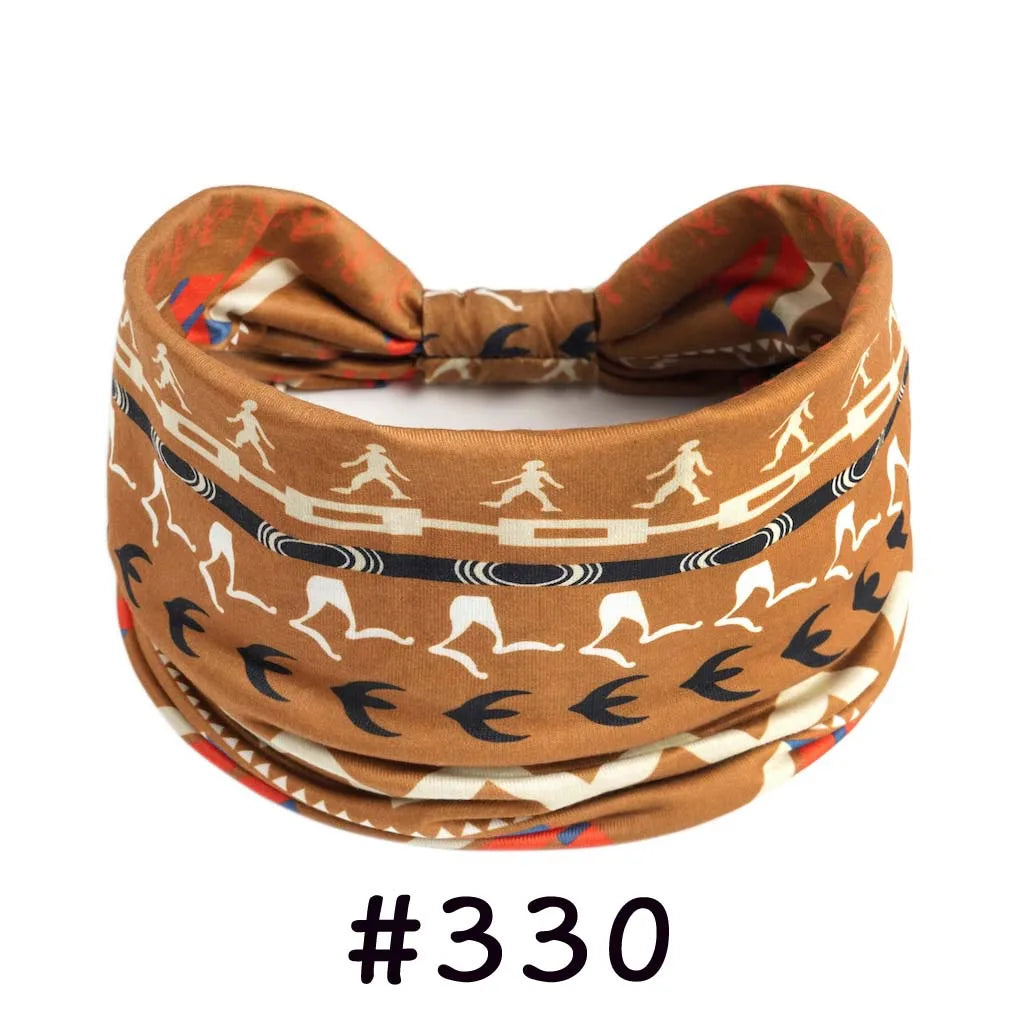 A brown patterned boho knotted cotton headband worn around the head.