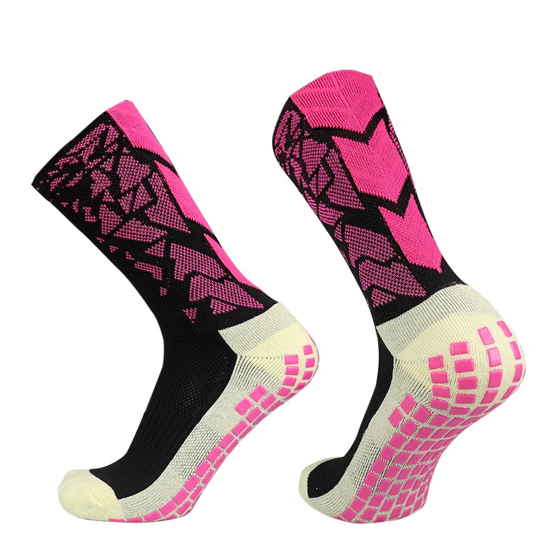 A pair of black and neon pink anti-slip training socks shown from the side.