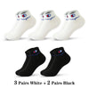 Three pairs of white ankle socks and two pairs of black ankle socks